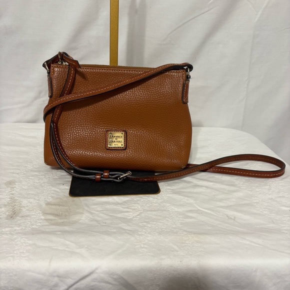 Dooney & Bourke Handbags - Dooney & Bourke Pebble Grain Crossbody Pouchette bag in a burnt orange color.